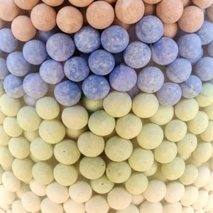 A close up of many different colored balls