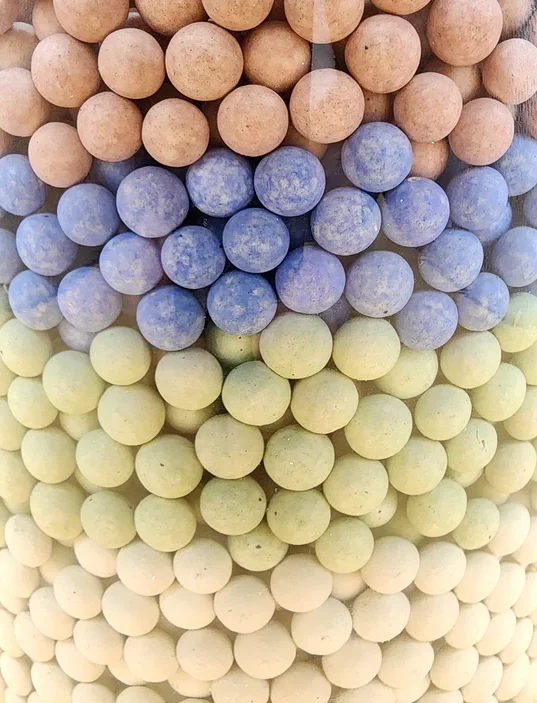 A close up of many different colored balls